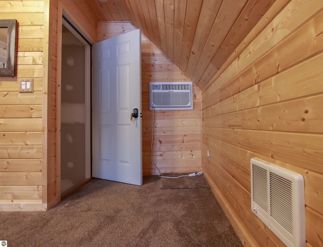 interior space with wood ceiling, heating unit, carpet, wood walls, and a wall mounted AC