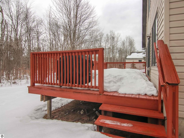 view of snow covered deck