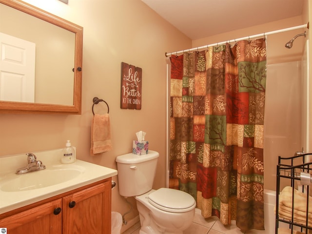 bathroom with a shower with shower curtain, vanity, toilet, and tile patterned floors