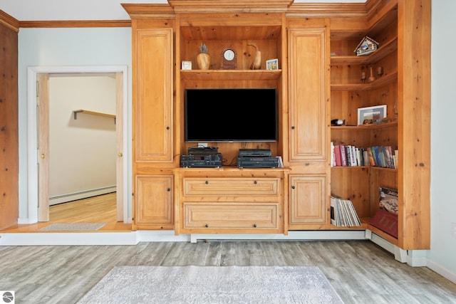 living room with built in features, crown molding, light wood-style flooring, a baseboard heating unit, and baseboards