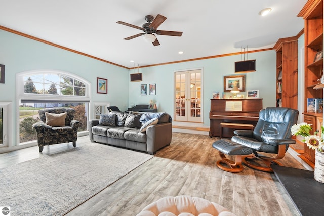 living room with ceiling fan, wood finished floors, crown molding, french doors, and recessed lighting