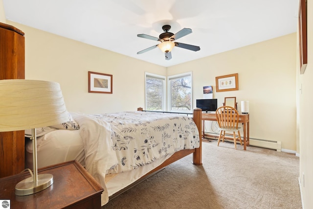 carpeted bedroom with a baseboard radiator, baseboards, and ceiling fan