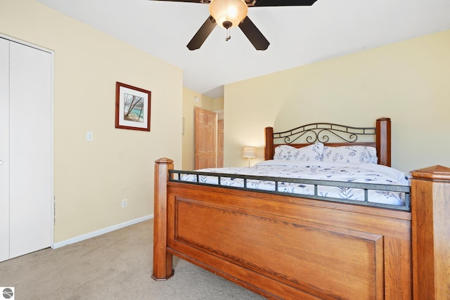 bedroom featuring baseboards, ceiling fan, and light colored carpet