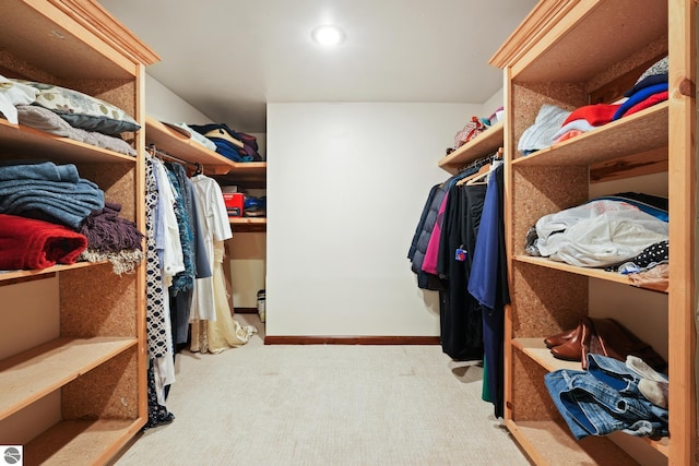 walk in closet featuring carpet