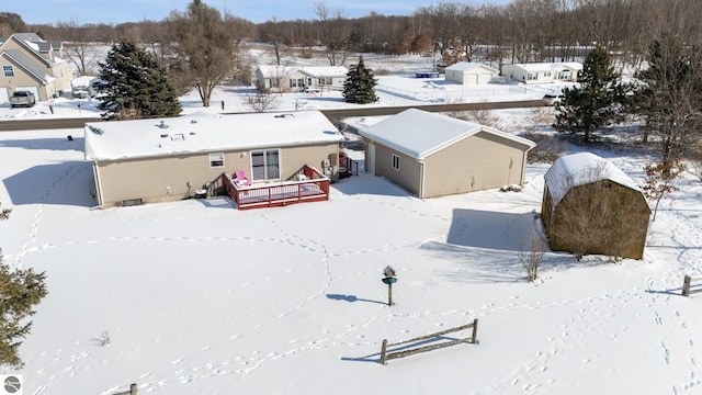 snowy aerial view featuring a residential view