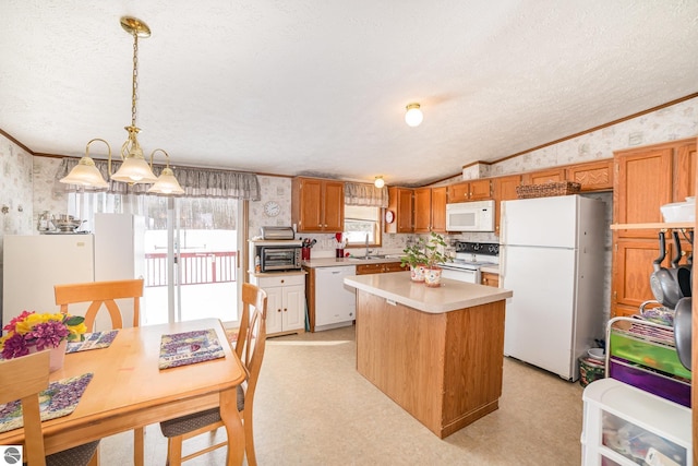 kitchen with wallpapered walls, white appliances, light floors, and light countertops