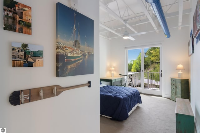 bedroom featuring access to exterior and carpet floors