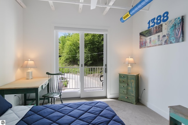 bedroom with baseboards, carpet, and access to exterior