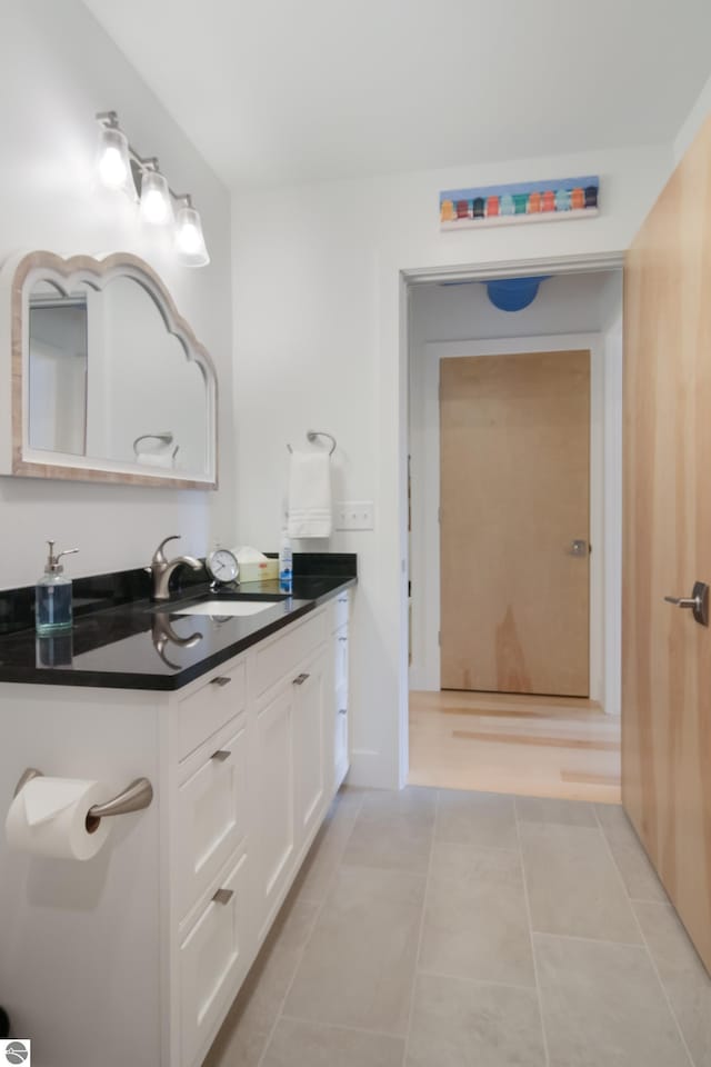 bathroom with vanity and tile patterned floors