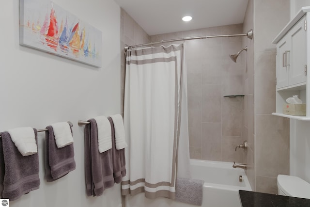 full bathroom featuring shower / tub combo and toilet