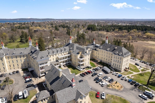 birds eye view of property with a view of trees