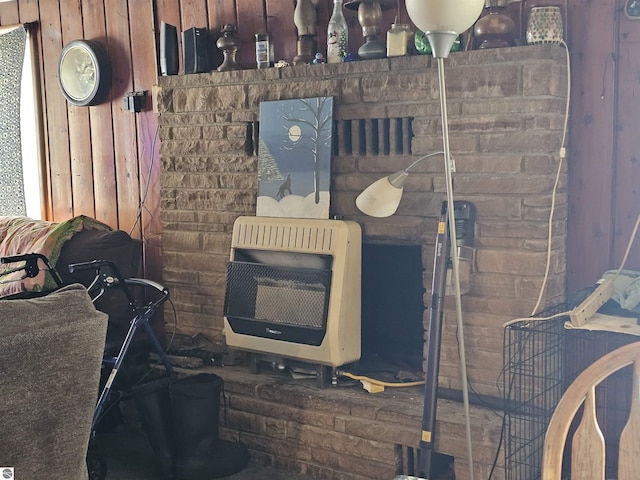 interior details with heating unit and wood walls