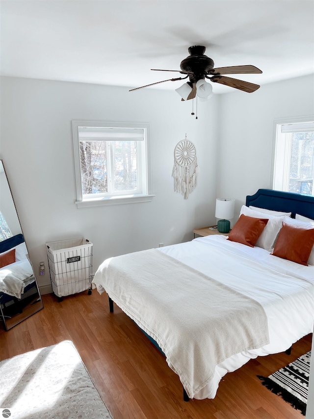 bedroom featuring ceiling fan and wood finished floors