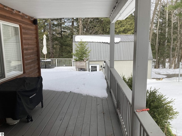 snow covered deck featuring grilling area