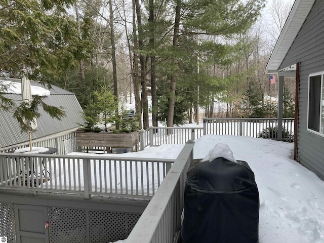 view of snow covered deck