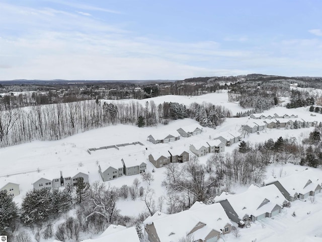 snowy aerial view featuring a residential view