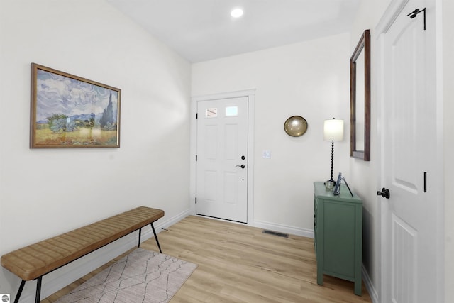 entryway featuring light wood-style floors, visible vents, baseboards, and recessed lighting