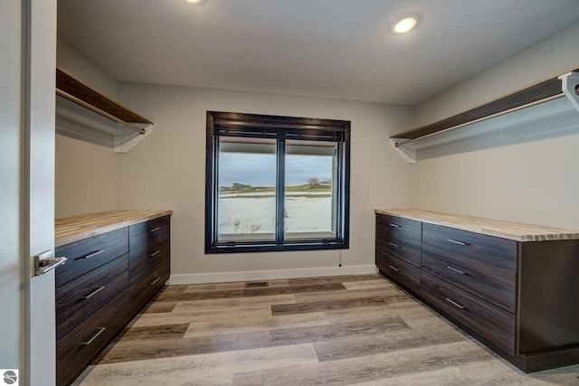 spacious closet with light wood-style flooring