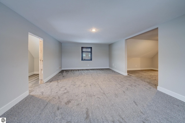 unfurnished room featuring baseboards and carpet floors