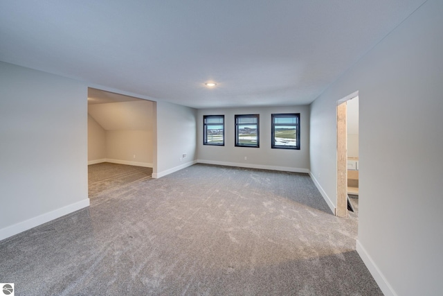 interior space with carpet flooring and baseboards