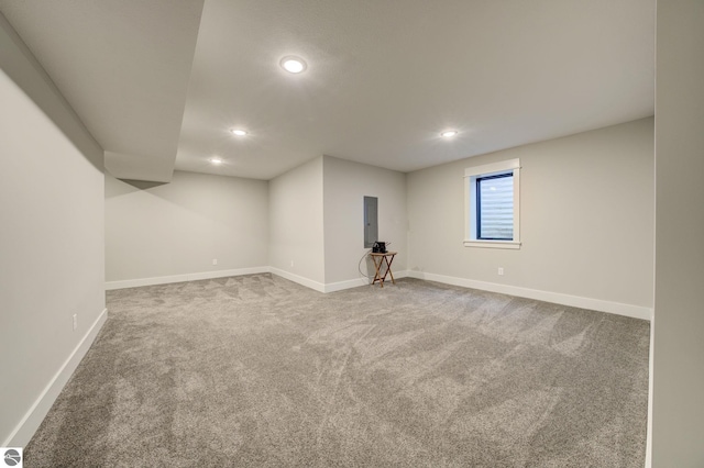 below grade area with recessed lighting, baseboards, and carpet