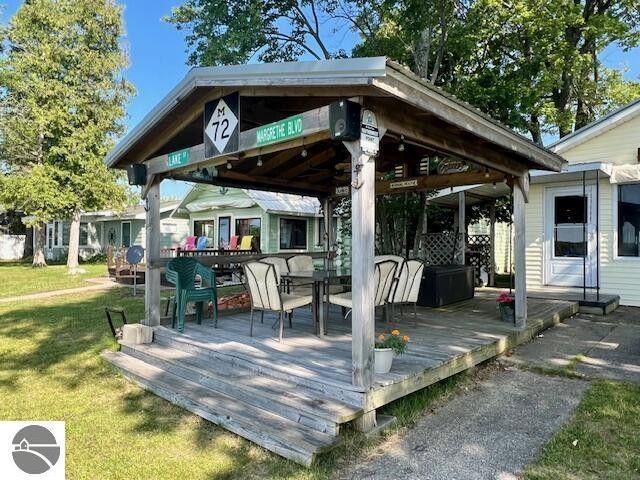 exterior space featuring a deck and a gazebo