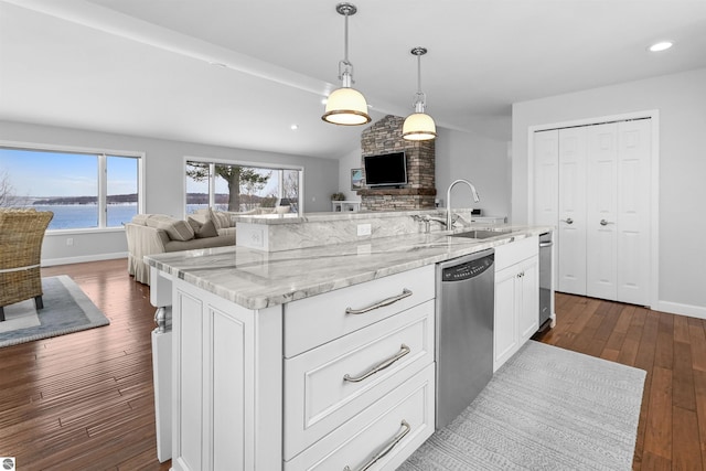 kitchen with lofted ceiling, open floor plan, dark wood-type flooring, stainless steel dishwasher, and a sink