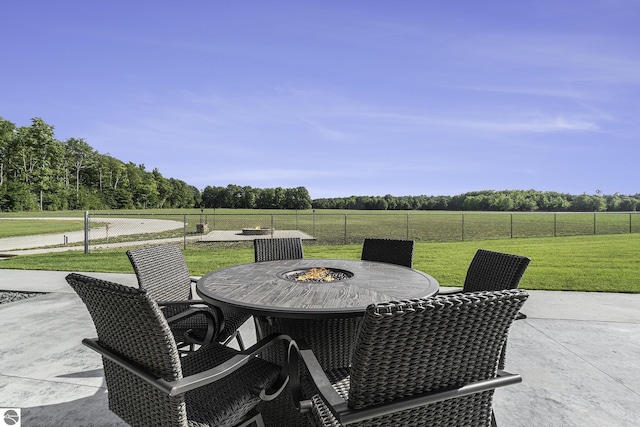 view of patio featuring outdoor dining space and fence