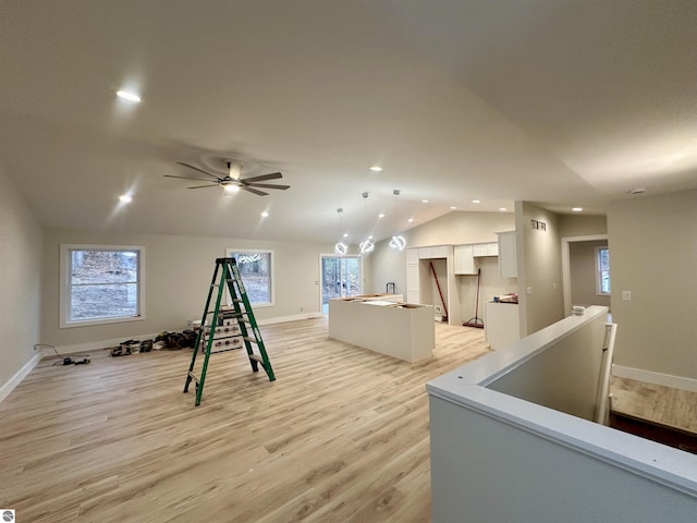 game room featuring lofted ceiling, light wood-style flooring, and recessed lighting