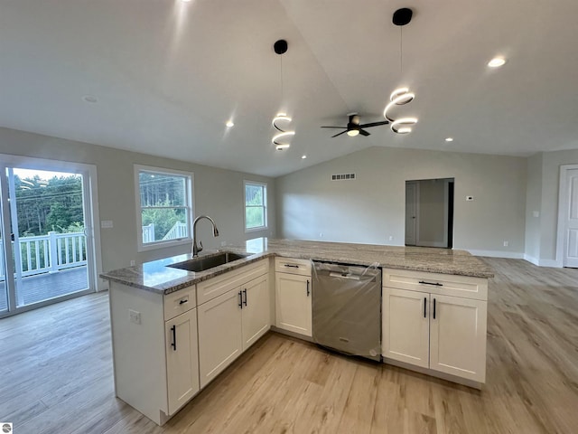 kitchen with open floor plan, visible vents, a sink, and stainless steel dishwasher