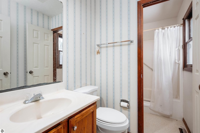 full bathroom with toilet, wallpapered walls, shower / tub combo with curtain, and vanity