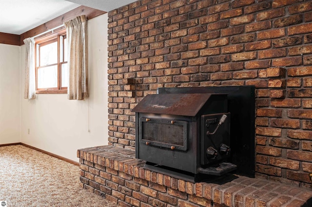 details with carpet, a wood stove, and baseboards