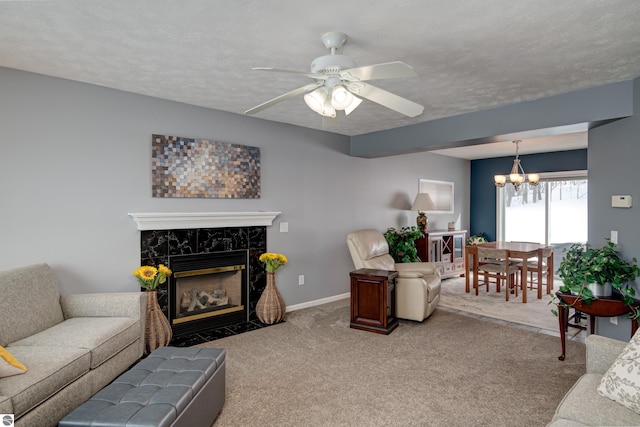 living area featuring a textured ceiling, a premium fireplace, carpet, and baseboards