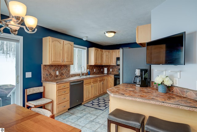 kitchen featuring dishwashing machine, black range with electric cooktop, light brown cabinets, a breakfast bar, and a sink