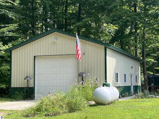 detached garage featuring driveway