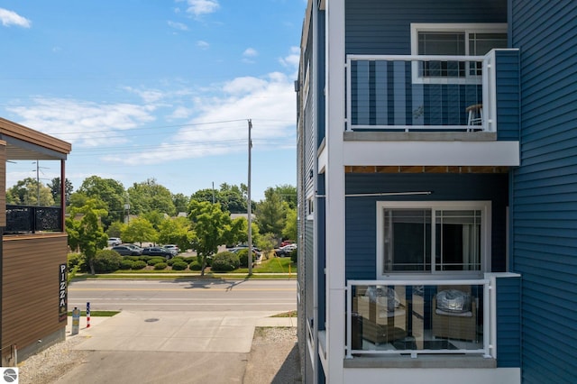 view of side of home with a balcony