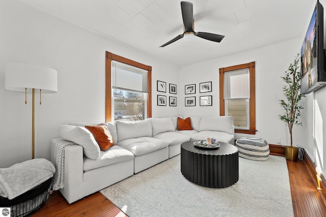 living room with ceiling fan and wood finished floors