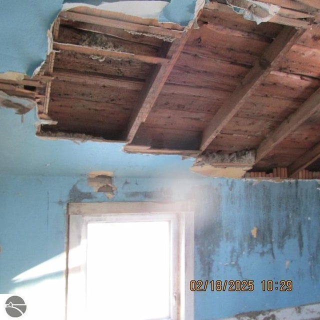 room details featuring wood ceiling and beam ceiling