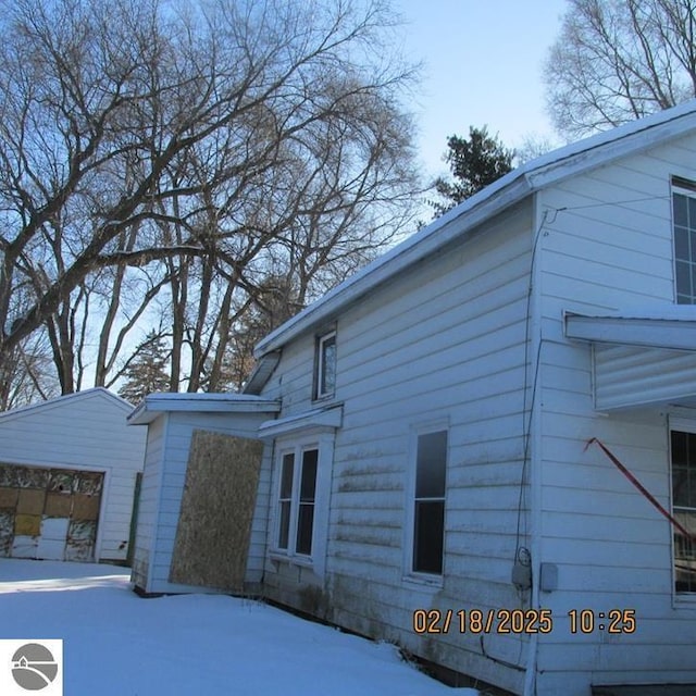 view of side of property with a garage