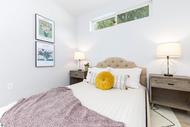 bedroom with wood finished floors