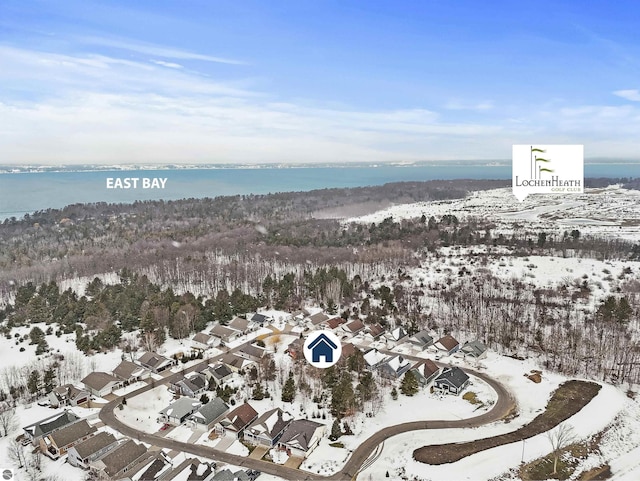 snowy aerial view featuring a residential view