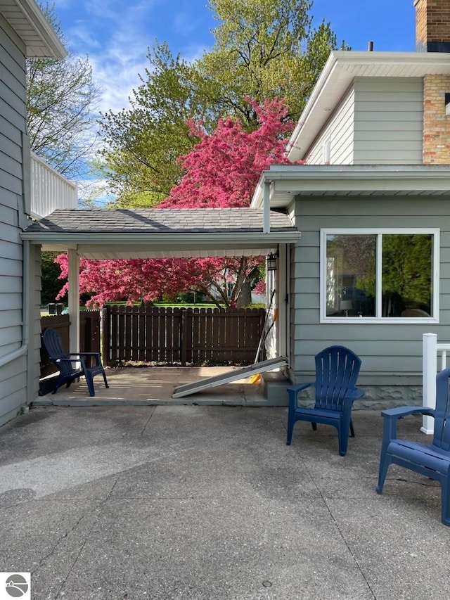 view of patio / terrace featuring fence