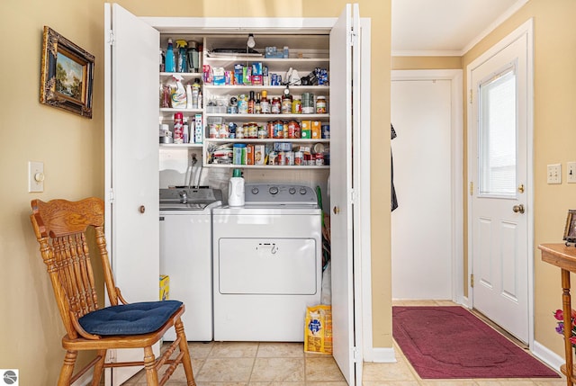 laundry room with light tile patterned floors, laundry area, and washer and dryer