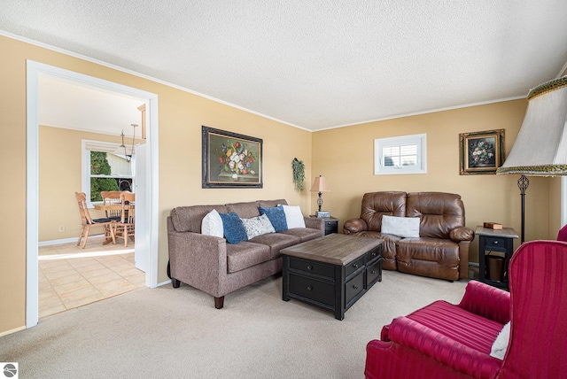 living room with crown molding, light tile patterned floors, light carpet, a textured ceiling, and baseboards