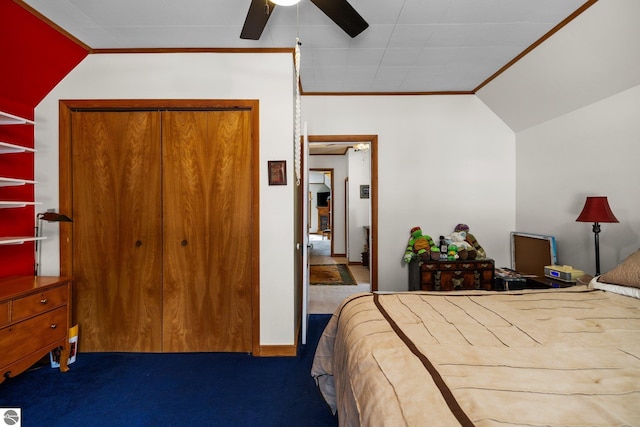 bedroom featuring carpet flooring, a ceiling fan, baseboards, vaulted ceiling, and crown molding