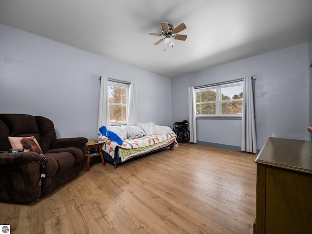 bedroom with light wood-type flooring and ceiling fan