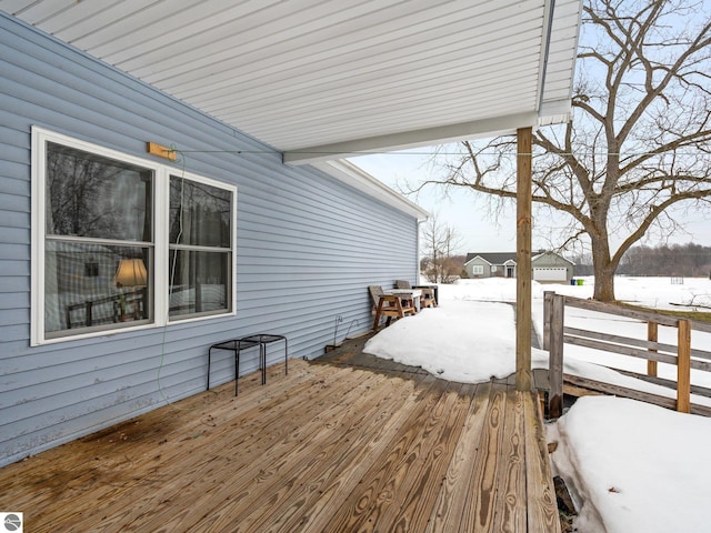 view of snow covered deck