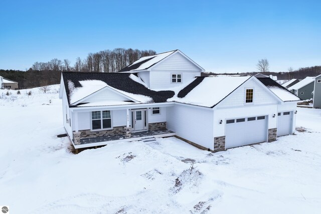 view of front of home with an attached garage and stone siding