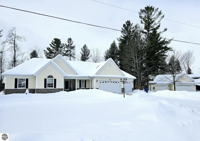 single story home featuring an attached garage and stone siding