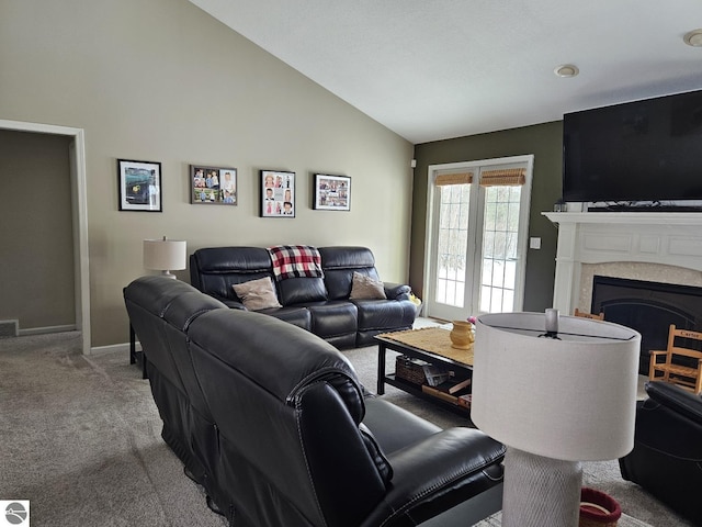 carpeted living room featuring high vaulted ceiling, visible vents, a fireplace, and baseboards